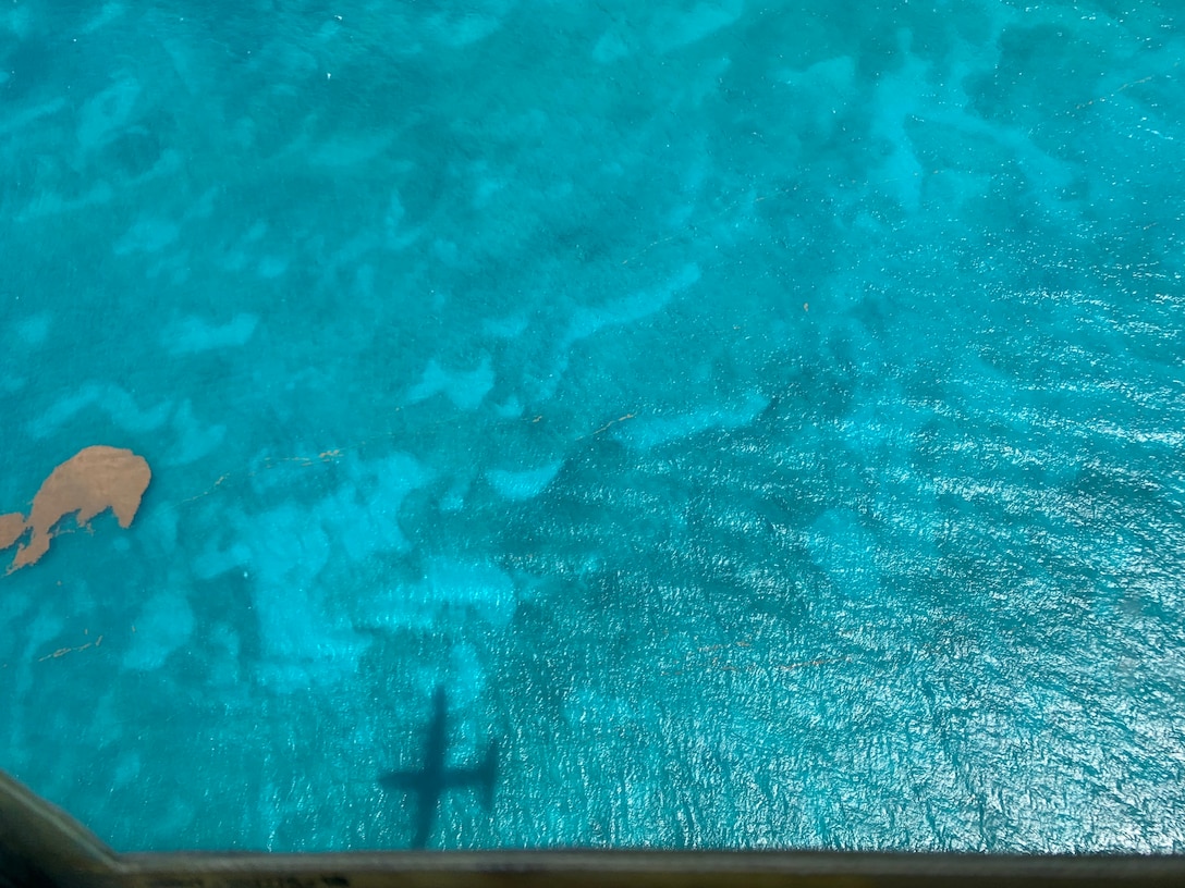 The shadow of  WC-130J Super Hercules aircraft over the water June 17, near St. Croix, U.S. Virgin Islands. The Hurricane Hunters deployed to St. Croix, to fly training missions over the Caribbean in preparation for the 2020 hurricane season. (U.S. Air Force photo by Tech. Sgt. Christopher Carranza)