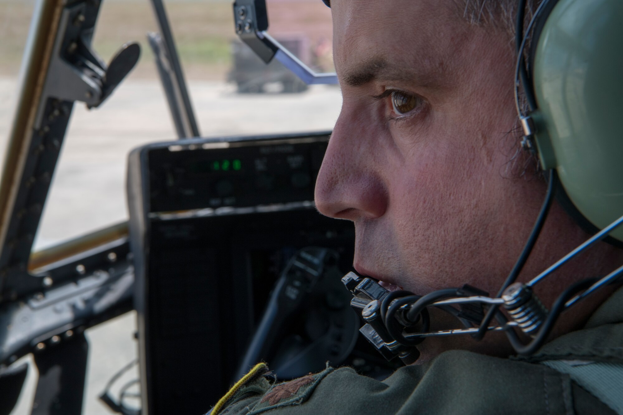 Maj. Brandon Roth, 53rd Weather Reconnaissance Squadron pilot, watches a spotter as he backs up the WC-130J Super Hercules aircraft, June 17, at Saint Croix, U.S. Virgin Islands. The Hurricane Hunters deployed to St. Croix to fly training missions over the Caribbean in preparation for the 2020 hurricane season. (U.S. Air Force photo by Tech. Sgt. Christopher Carranza)