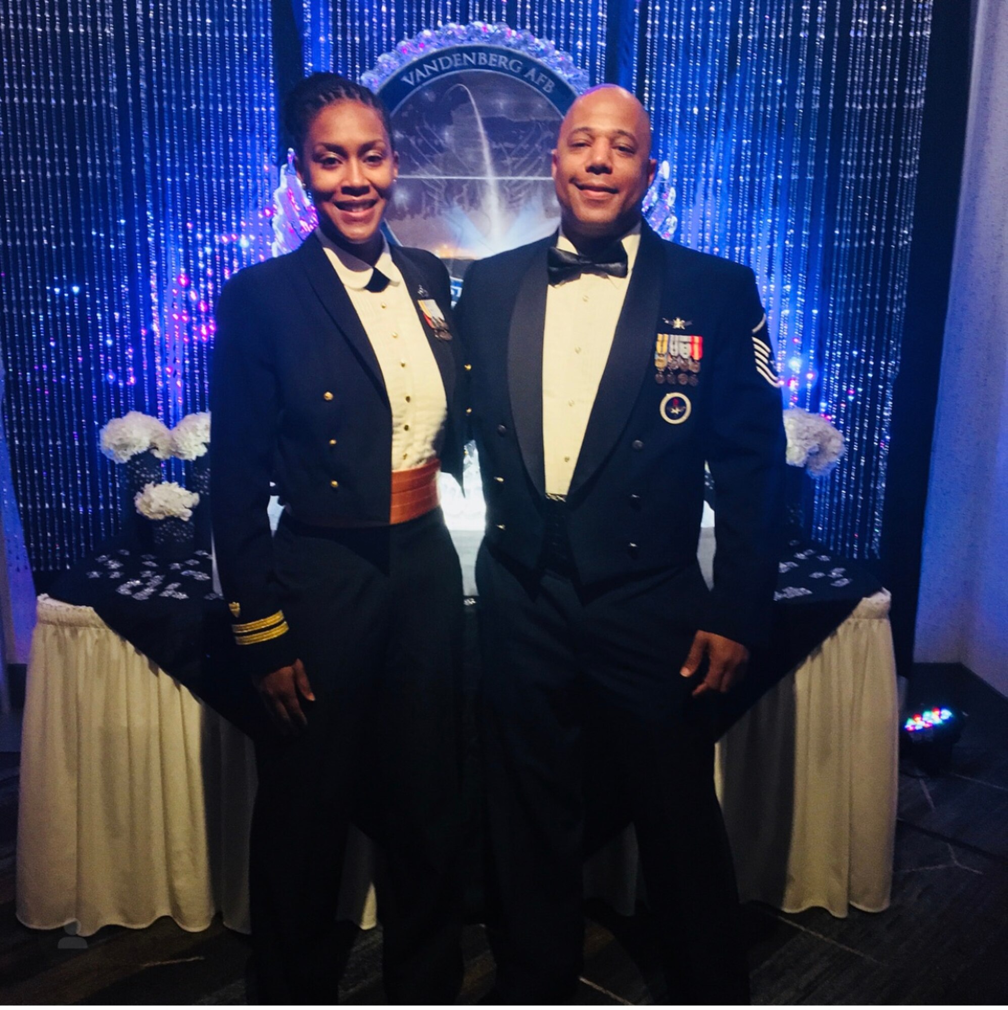 Master Sgt. Cederic Hill, 614th Combat Operations Division Combined Space Operations Center theater watch chief, and his best friend Audrey pose for a photo at the 2018 Vandenberg Air Force Ball.