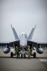 Two U.S. Navy assets perform a pre-flight check on a Boeing EA-18G during a PAC Weasel exercise at Misawa Air Base, Japan, June 19, 2020. During PAC Weasel, pilots practiced flying SEAD missions, escort missions, strike missions as well as anti-surface warfare. Escort missions consist of escorting the strikers into the target area in order to drop bombs while taking out the OPFOR (opposition forces). The pilots on strike missions focused on dropping bombs within the target area. (U.S. Air Force photo by Airman 1st Class China M. Shock)