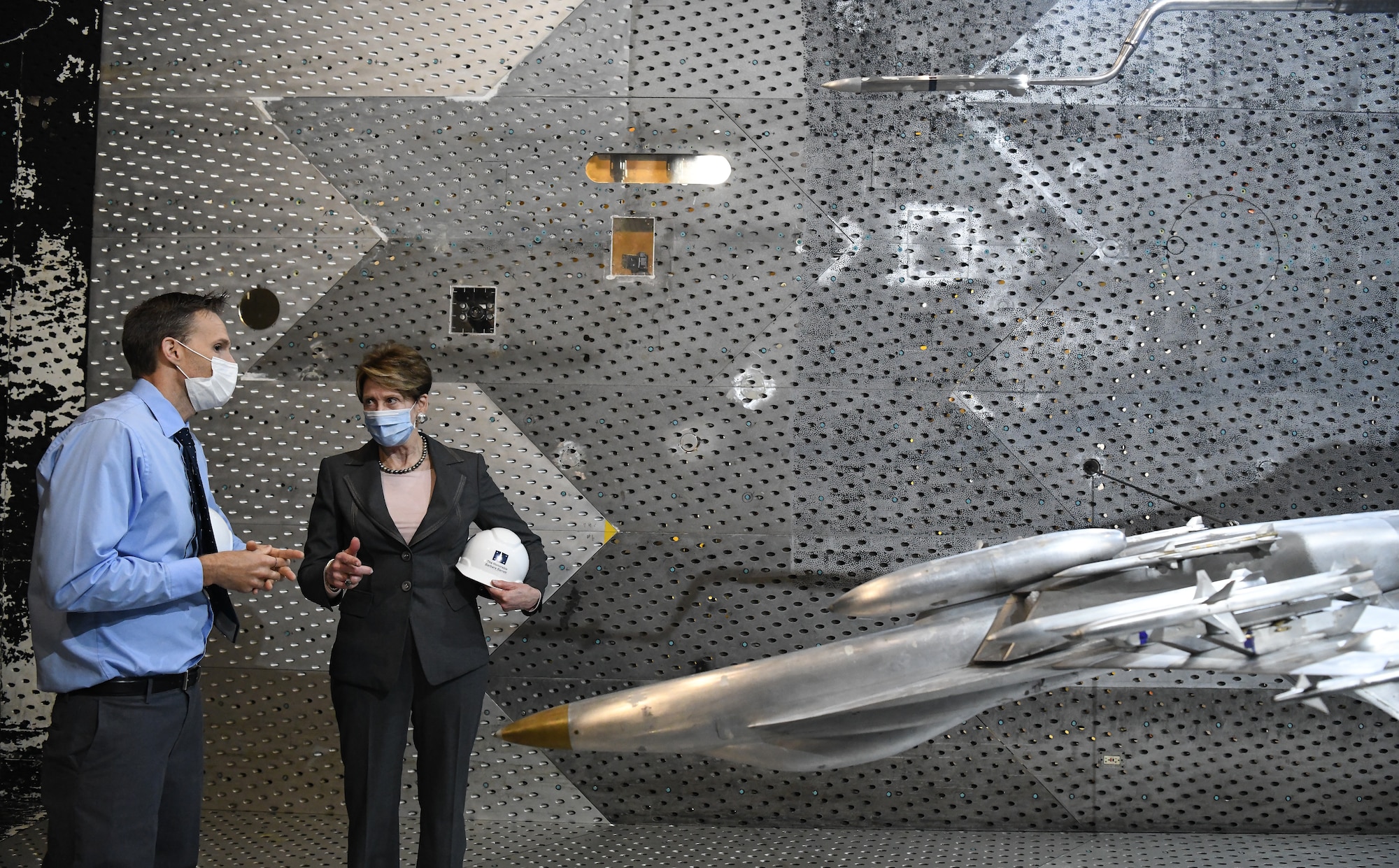 Dr. Rich Roberts, flight commander for store separation, speaks with Secretary of the Air Force Barbara Barrett about a store separation test of an AARGM-ER from an F-18 Super Hornet using models in the Arnold Engineering Development Complex 16-foot Transonic Wind Tunnel at Arnold Air Force Base, Tenn., June 18, 2020. (U.S. Air Force photos by Jill Pickett)
