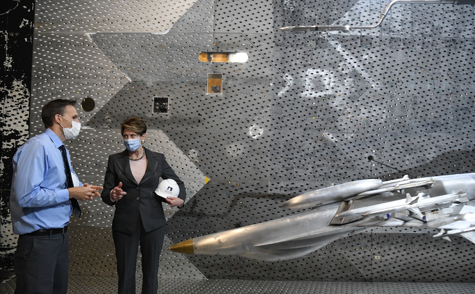 Dr. Rich Roberts, flight commander for store separation, speaks with Secretary of the Air Force Barbara Barrett about a store separation test of a AARGM-ER from an F-18 Super Hornet using models in the Arnold Engineering Development Complex 16-foot Transonic Wind Tunnel at Arnold Air Force Base, Tenn., June 18, 2020. (U.S. Air Force photo by Jill Pickett)