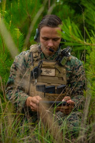 Lance Cpl. Ryan Caltabiano, a forward observer with 2nd Air Naval Gunfire Liaison Company, II Marine Expeditionary Force Information Group, poses for an photo on Camp Lejeune, N.C., June 17, 2020. “The essence of great leadership is influence, not authority,” said Caltabiano, an East Setauket, N.Y., native. According to his leadership, Caltabiano has distinguished himself as a critical asset to the unit, both inside and outside of his military occupation specialty. During the company’s naval gunfire exercise, Caltabiano conducted multiple calls for fire and established high frequency communications with the USS Mahan, utilizing a field expedient antenna. (U.S. Marine Corps photo by Lance Cpl. Haley McMenamin)
