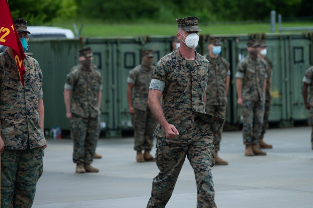 unnery Sgt. Thomas Hebner, the company gunnery sergeant with Lima Company, 3rd Battalion, 2nd Marine Regiment, 2d Marine Division, marches to receive a Navy and Marine Corps Achievement Medal for his role in Operation Gotham on Camp Lejeune, North Carolina, June 16, 2020. Lima Company Marines earned the awards for their efforts in New York City assisting the hospital ship USNS Comfort (T-AH 20) during the COVID-19 pandemic. (U.S. Marine Corps photo by Sgt. Stormy Mendez)