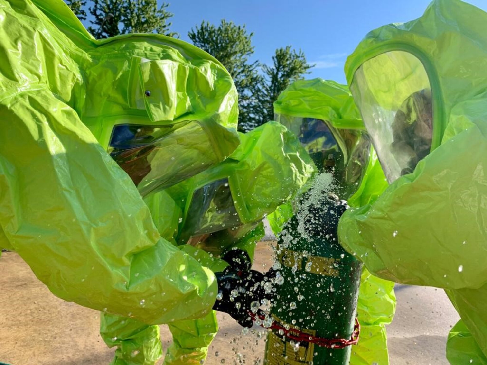 Staff Sgt. Patrick Iliff, Senior Airman Eva Chupp, Master Sgt. Anthony Chico, and Staff Sgt. Clint Hazlett, 434th Civil Engineering Squadron emergency management apprentices, cap a simulated leak on a chlorine canister. Emergency managers must be prepared at all times to respond to manmade and natural disasters both on base and in deployed locations at any time. (U.S. Air Force photo / Staff Sgt. Clint Hazlett)