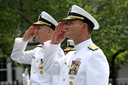 Vice Admiral William J. Galinis (right) and Vice Admiral Thomas J. Moore salute Galinis' flag during the Naval Sea Systems Command (NAVSEA) Change of Command Ceremony in Leutze Park at the Washington Navy Yard.