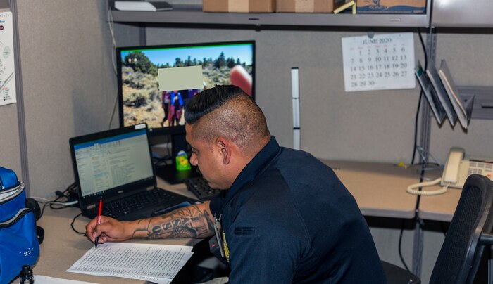 Corporal Philip Jasso completes reports in his new office at was once the Base Safety Department.