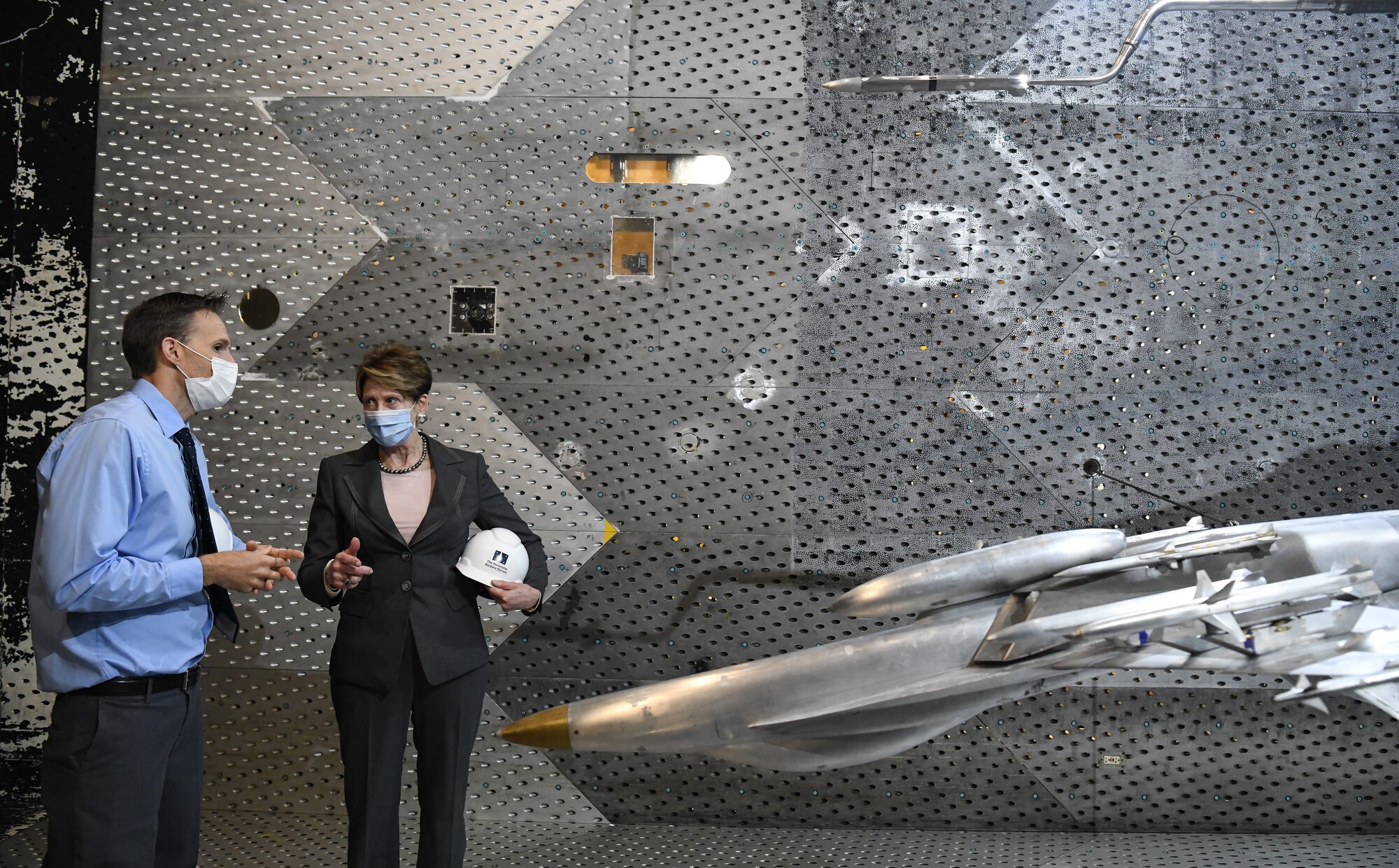 Dr. Rich Roberts, flight commander for store separation, speaks with Secretary of the Air Force Barbara Barrett about a store separation test of a AARGM-ER from an F-18 Super Hornet using models in the Arnold Engineering Development Complex 16-foot Transonic Wind Tunnel at Arnold Air Force Base, Tenn., June 18, 2020. (U.S. Air Force photo by Jill Pickett)