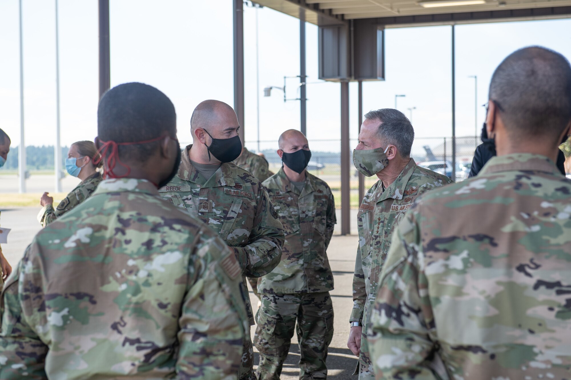 Gen. David Goldfein, chief of staff of the Air Force, right, and Senior Master Sgt. Jonathan Reece, 62nd Aircraft Maintenance Squadron, left, discuss how the wing has continued aircraft maintenance while taking steps to prevent COVID-19 at Joint Base Lewis-McChord, Wash., June 18, 2020. Goldfein visited JBLM to see firsthand how operations within Team McChord have been continuing to provide airlift support during the COVID-19 pandemic. (U.S. Air Force photo by Senior Airman Sara Hoerichs)