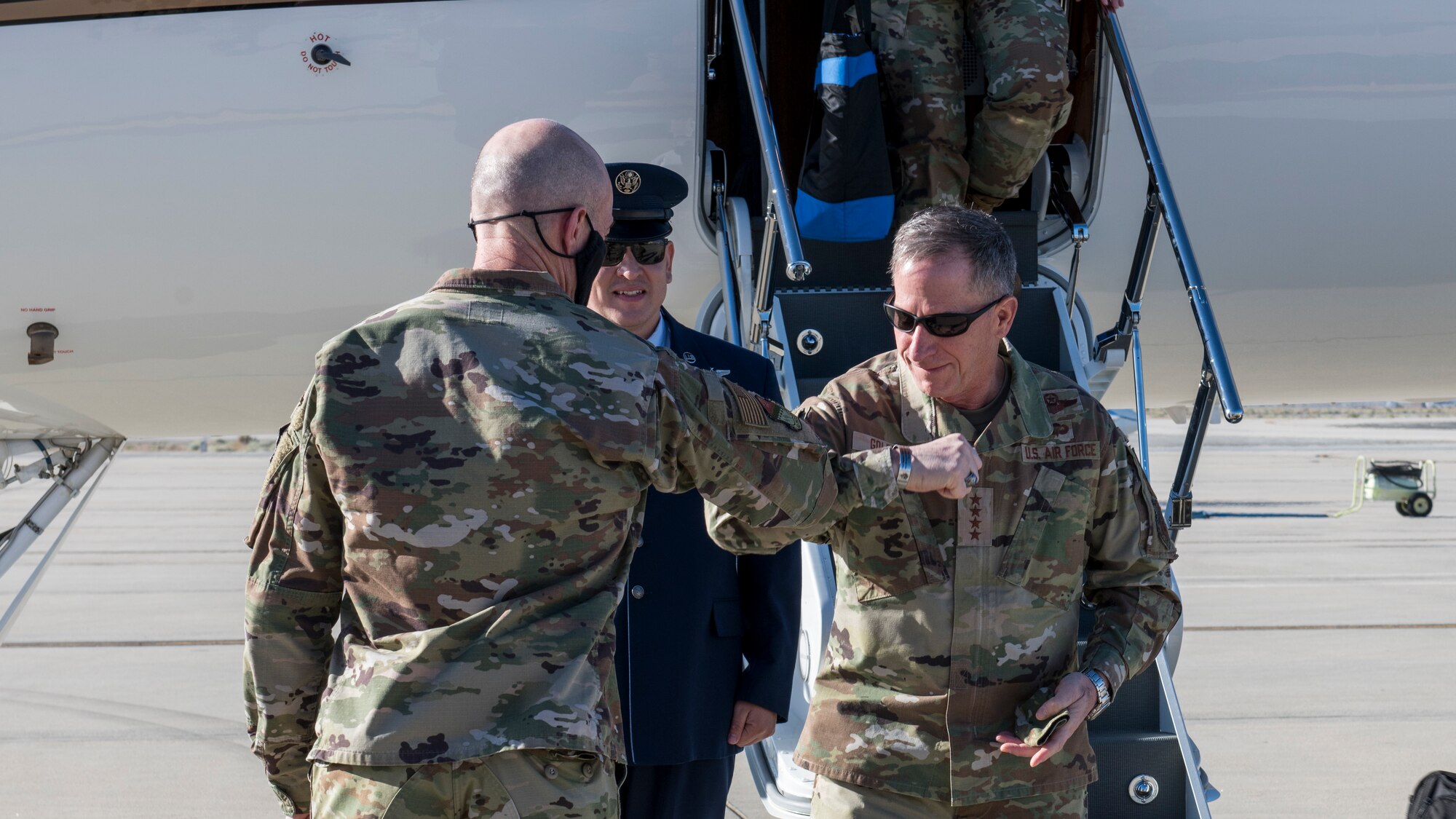 Maj. Gen. Christopher Azzano, Air Force Test Center commander, greets Air Force Chief of Staff Gen. David Goldfein at Edwards Air Force Base, California, June 17. (Air Force photo by Giancarlo Casem)