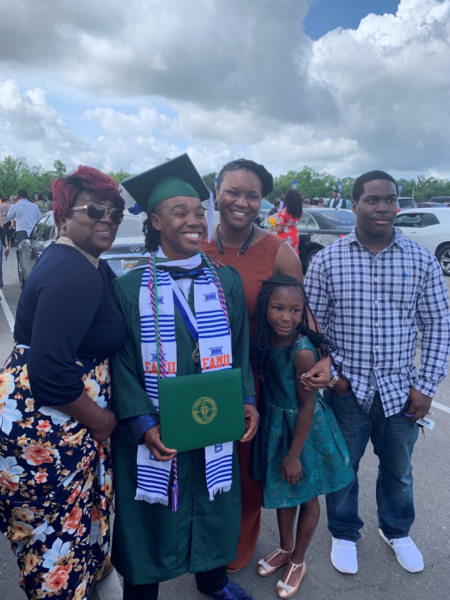 U.S. Air Force 2nd Lt. Destini Hamilton is greeted by family after her graduation day.