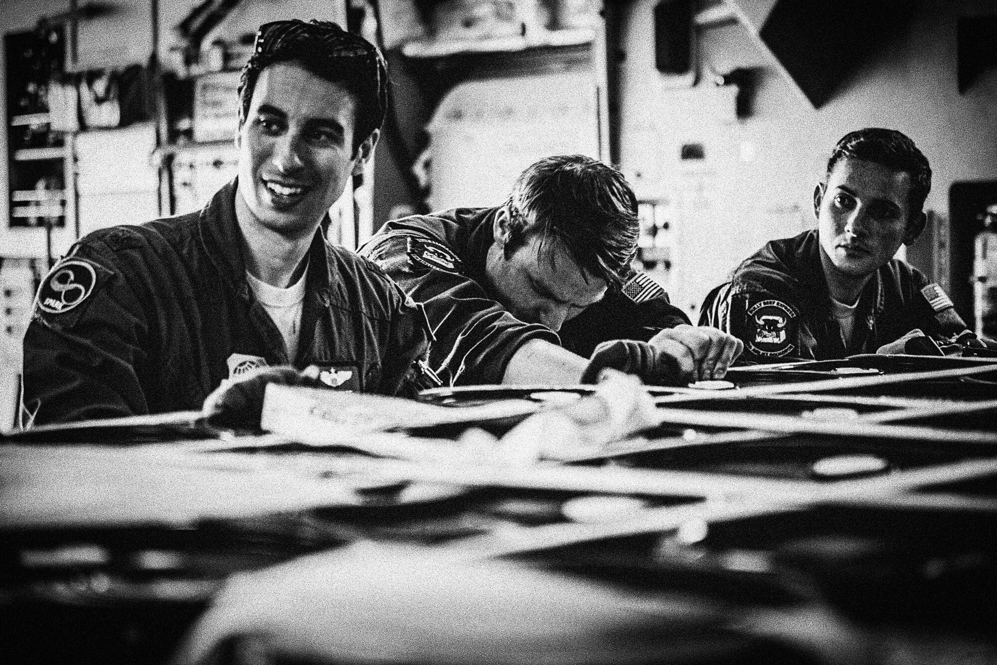 Photo of three Airmen hanging out.
