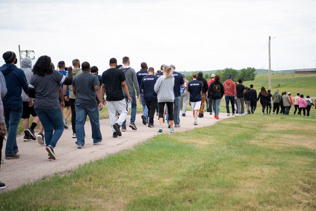 Airmen assigned to the 28th Bomb Wing participate in a memorial walk for Juneteenth at Ellsworth Air Force Base, S.D., June 19, 2020. Juneteenth marks the anniversary of when Union Army General Gordon Granger announced the federal orders proclaiming all people held as slaves in Texas were free. (U.S. Air Force photo by Airman 1st Class Austin McIntosh)