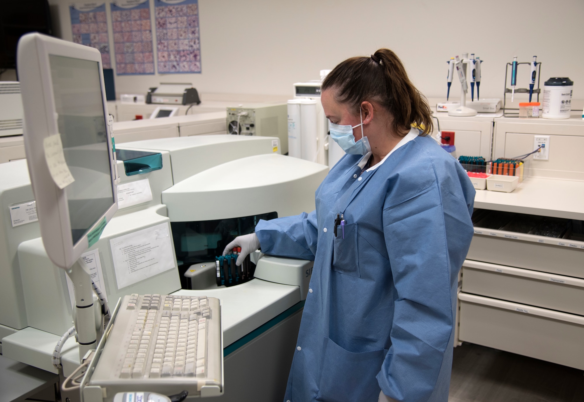PETERSON AIR FORCE BASE, Colo. - Corey Cavanaugh, lead chemistry technician at the 21st Medical Group laboratory, prepares samples for testing. The lab at Peterson Air Force Base, Colorado, generates more than 4,700 lab results on average each month. (U.S. Air Force photo by Kristen Allen)