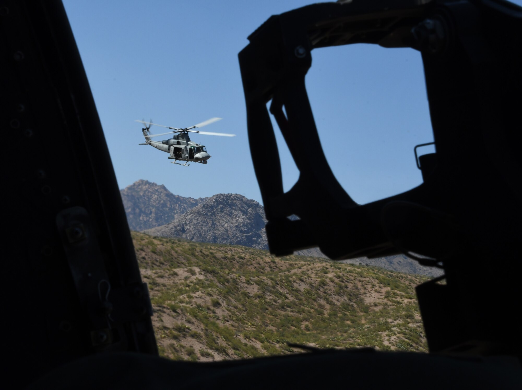 A photo of a helicopter flying.
