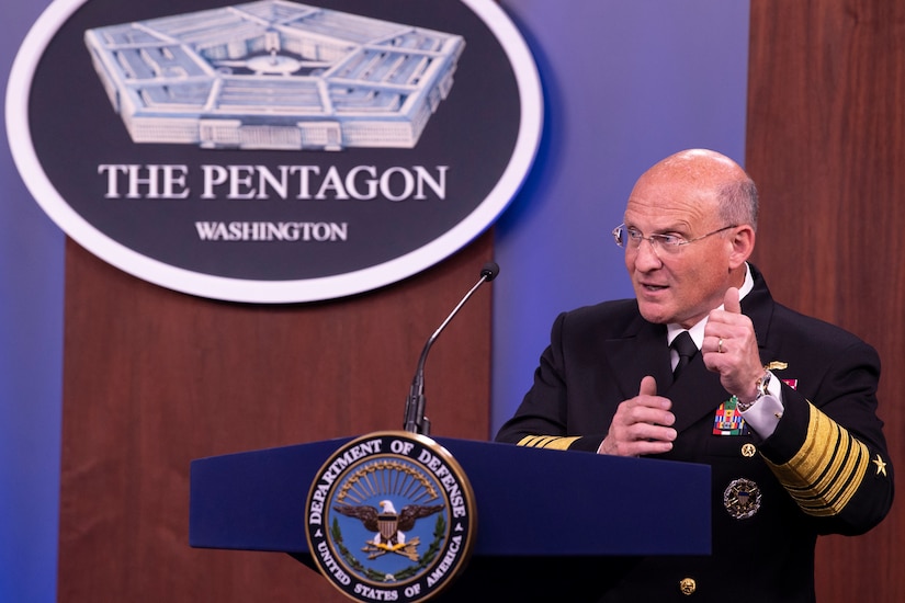 A man in military uniform stands behind a lectern.  Behind him is a sign that says “Pentagon - Washington.”