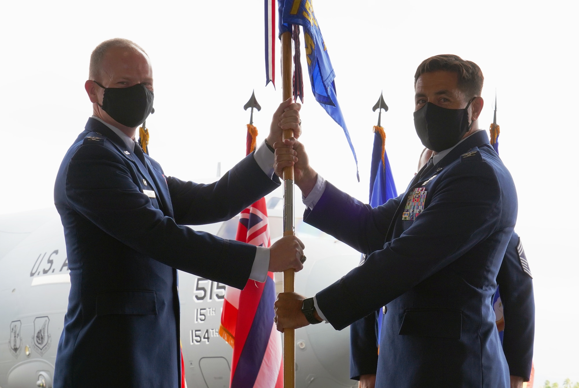 Col. Robert Blake accepts command from Col. W. Halsey Burks, 15th Wing commander, of the 15th Maintenance Group during a change of command ceremony on Joint Base Pearl Harbor-Hickam, Hawaii, June 18, 2020. Blake assumed command of the 15th MXG after Col. Dominc Clementz relinquished command. (U.S. Air Force photo by Airman 1st Class Erin Baxter)
