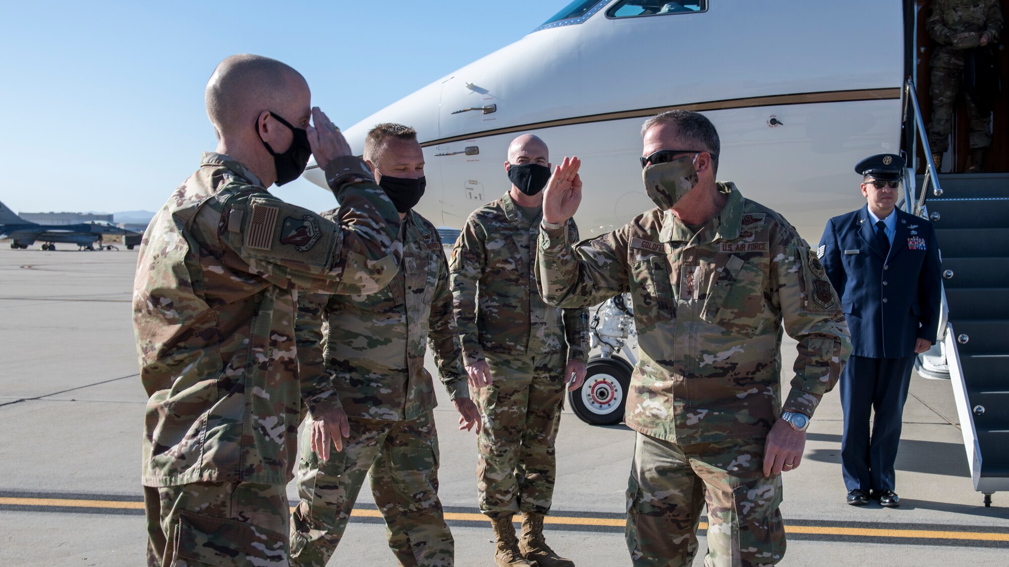 Brig. Gen. Matthew Higer, 412th Test Wing commander, salutes Air Force Chief of Staff Gen. David Goldfein at Edwards Air Force Base, California, June 17. (Air Force photo by Giancarlo Casem)