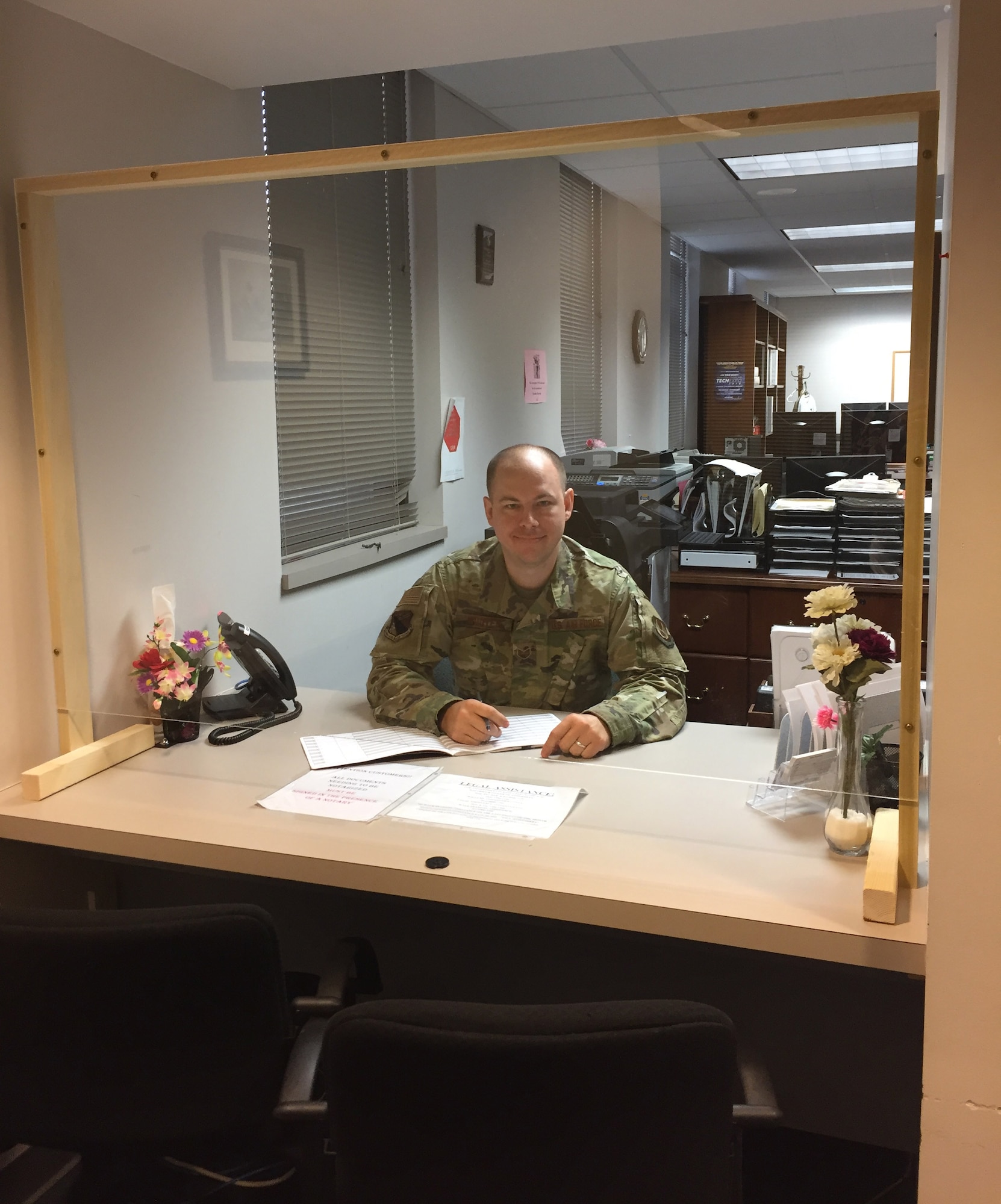 Staff Sgt. Derek Wooten, a paralegal in the 88th Air Base Wing Legal Office, Wright-Patterson Air Force Base, shows on June 16 how the Legal clinic has been modified to protect clients due to the COVID-19 pandemic. Due to the declared public health emergency on base, in-person consultations are limited to specific situations at this time at this time. (Skywrighter photo/Amy Rollins)