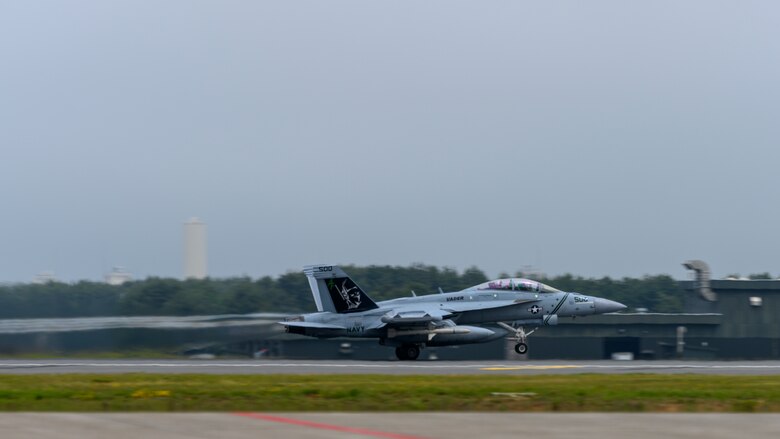 A U.S. Navy Boeing EA-18G takes off down the runway during a PAC Weasel exercise at Misawa Air Base, Japan, June 19, 2020. During PAC Weasel, pilots practiced flying SEAD missions, escort missions, strike missions as well as anti-surface warfare. (U.S. Air Force photo by Airman 1st Class China M. Shock)