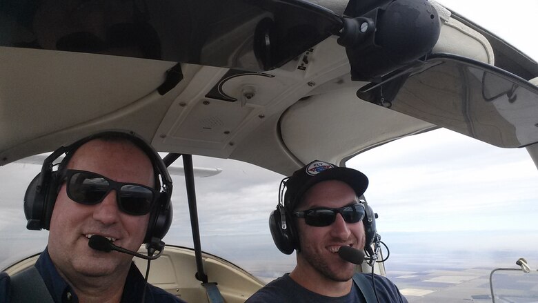 Bryan Burns, left, 60th Operations Support Squadron contracting officer’s representative, teaches his son Josh how to fly in a Piper PA-38 Tomahawk Jan. 14, 2019, over Vacaville, California. When Josh told his father he wanted to be a pilot, Bryan didn’t hesitate to take him up and teach him how. (courtesy photo)