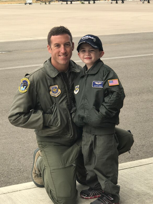 U.S. Air Force 2nd Lt. Josh Burns, left, 6th Air Refueling Squadron pilot, poses with his son, Austin, in front of T-6 Texans for a photo Feb. 3, 2020, at Laughlin Air Force Base, Texas. Josh took his son out to see the same aircraft he learned to fly in, when he was learning from his father that started his pilot career. (courtesy photo)