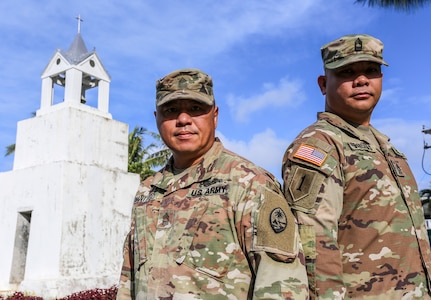 Brothers-in-law and Master Sgts. Joseph Santiago, left, and Andrew Barcinas, of the Guam National Guard, prepare for the Sergeants Major Academy in Merizo, Guam on May 15.