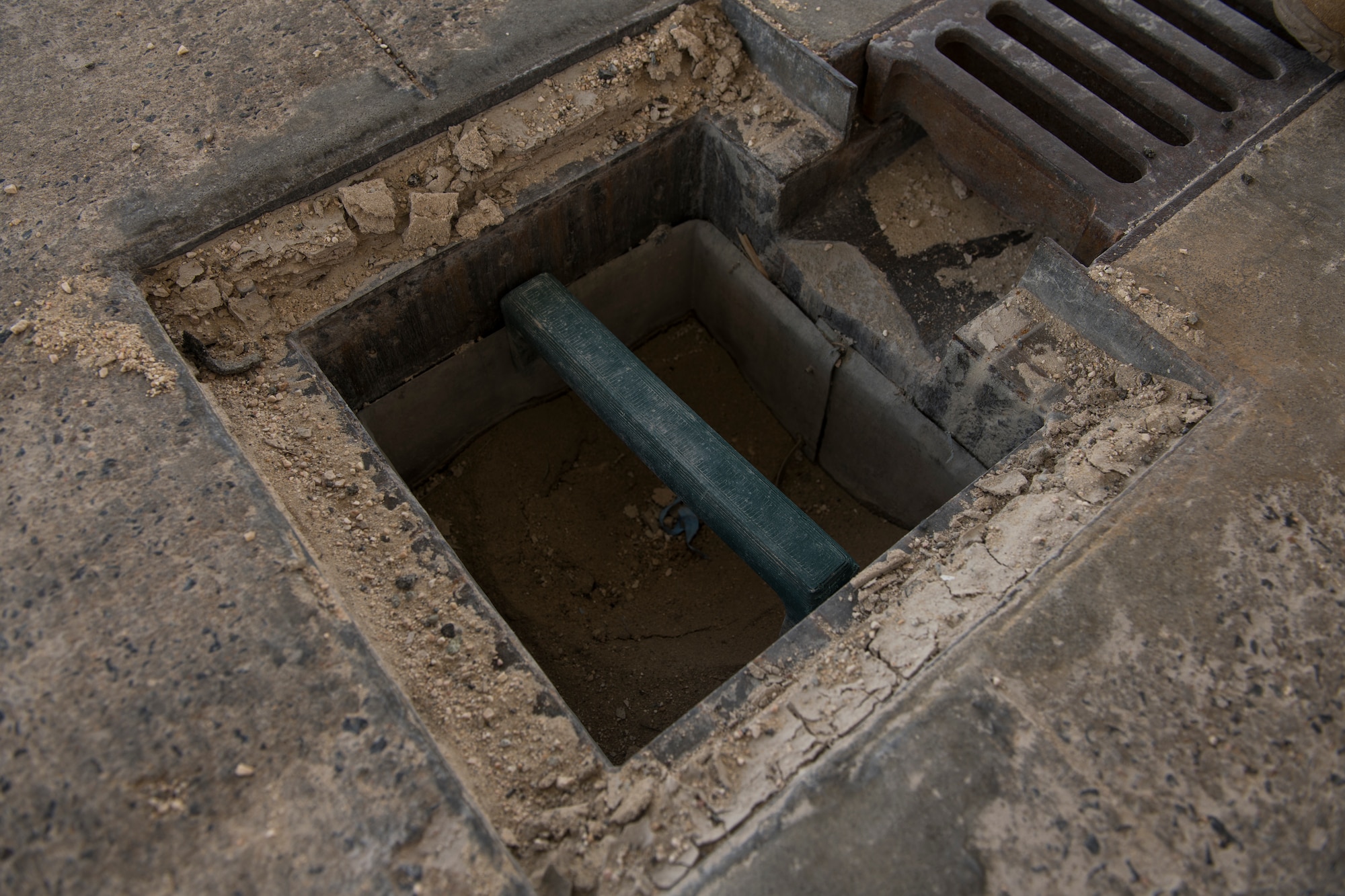 A drainage pan rests in a vehicle wash rack at Al Udeid Air Base, Qatar, June 13, 2020.