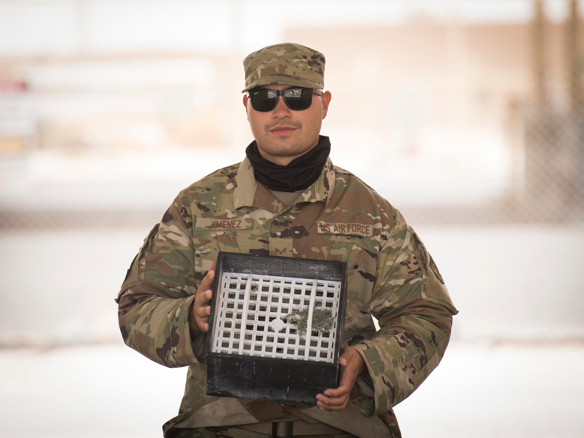 U.S. Air Force Senior Airman Fernando Jimenez, a vehicle operator assigned to the 379th Expeditionary Logistics Readiness Squadron, displays his team’s winning submission in the U.S. Air Forces Central Command Spark Tank competition at Al Udeid Air Base, Qatar, June 13, 2020.