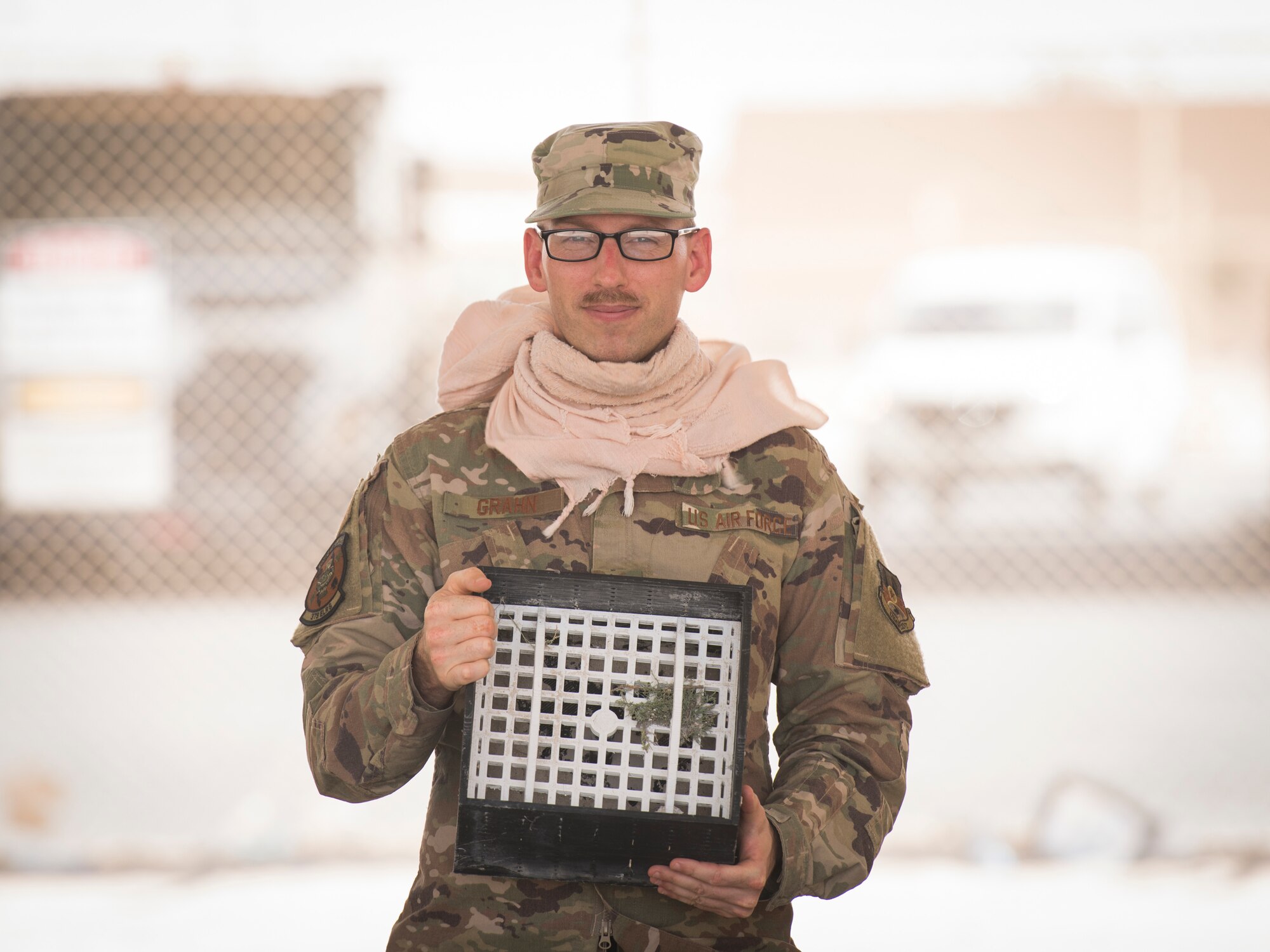 U.S. Air Force Staff Sgt. Justin Grahn, a vehicle operator assigned to the 379th Expeditionary Logistics Readiness Squadron, displays his team’s winning submission in the U.S. Air Forces Central Command Spark Tank competition at Al Udeid Air Base, Qatar, June 13, 2020.