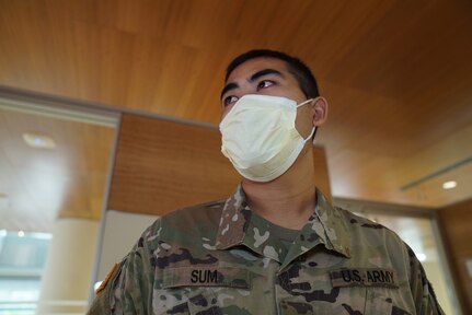 Pfc. Dal Sum, an infantryman with Company C, 1st Battalion, 148th Infantry Regiment, is recognized by Col. Matthew Woodruff, commander of the 37th Infantry Brigade Combat Team and Joint Task Force 37, May 8, 2020, at The Ohio State University Wexner Medical Center in Columbus. Sum answered the call when nurses needed a Burmese translator who speaks Zomi to communicate with a pregnant COVID-19 patient.