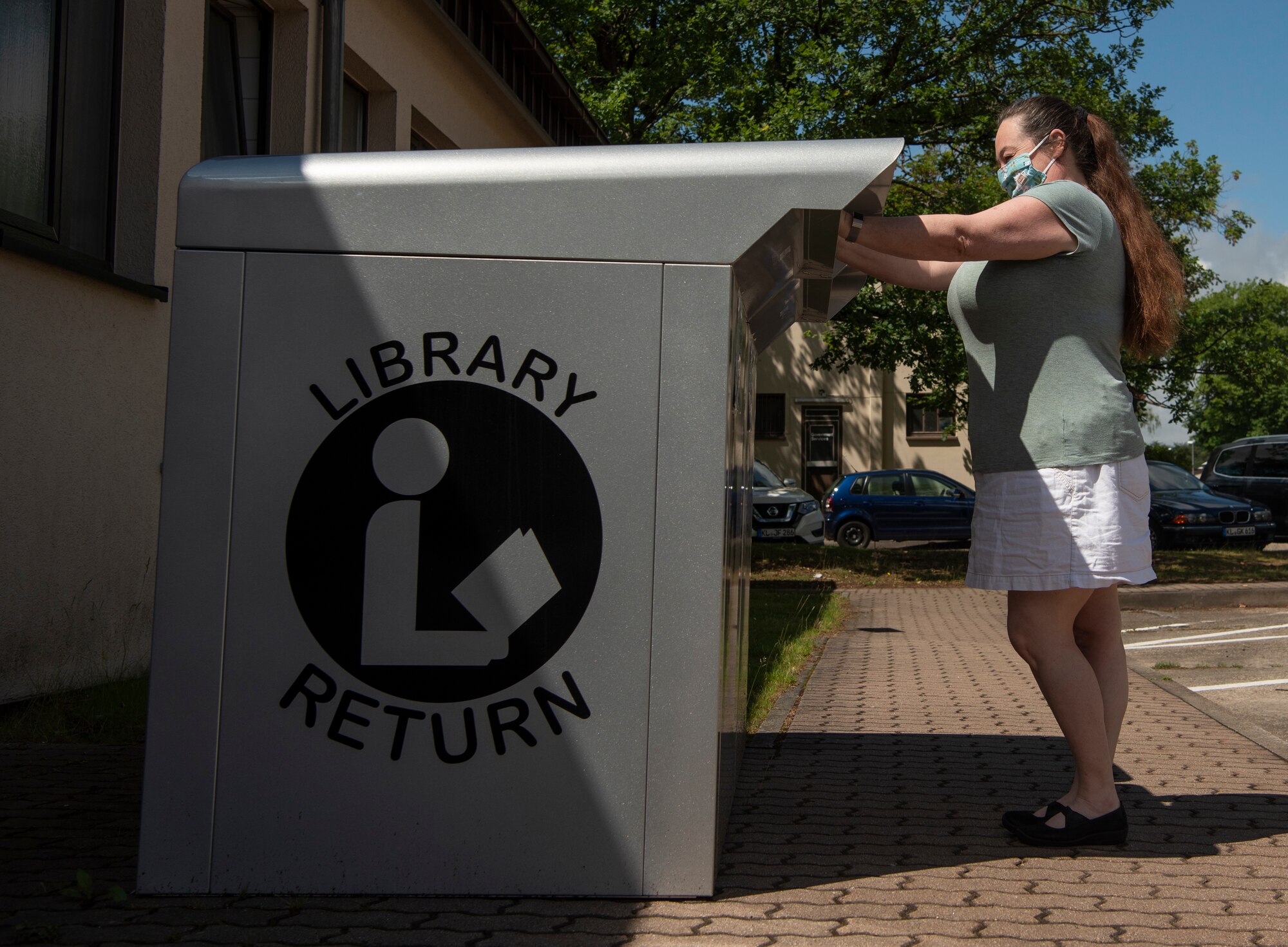 The return bin is for the safety of the customers and the staff. Due to regulations, library materials cannot be sanitized by hand and are quarantined for seven days in an isolated room.