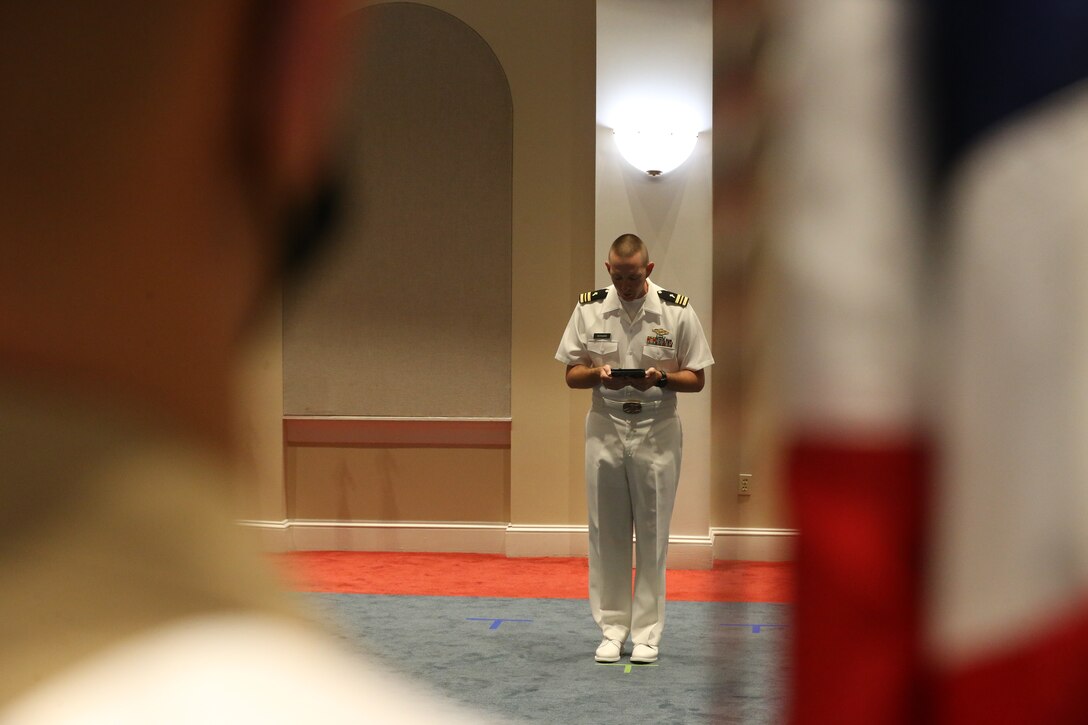 Lieutenant Cmdr. Justin Bernard, Barracks chaplain, delivers the invocation during a change of command ceremony at Marine Barracks Washington D.C., June 17, 2020. Colonel Donald J. Tomich relinquished his command of Marine Barracks Washington D.C. to Col. Teague A. Pastel. Pastel previously served as the Deputy Commandant for Information (DC I) where he served as the Director, Plans and Strategy Division.