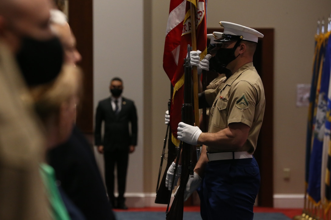 The U.S. Marine Corps Color Guard presents the National Ensign during a change of command ceremony at Marine Barracks Washington D.C., June 17, 2020. Colonel Donald J. Tomich relinquished his command of Marine Barracks Washington D.C. to Col. Teague A. Pastel. Pastel previously served as the Deputy Commandant for Information (DC I) where he served as the Director, Plans and Strategy Division.