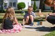 April Tyndall, right, and her children, James and Olivia Tyndall, draw with chalk on the sidewalk outside their home during the 66th Support Squadron’s Sidewalk Chalk Day at Hansom Air Force Base, Mass., June 17. The event was hosted throughout base housing, and residents were challenged to decorate their driveways to showcase Hanscom community pride. (U.S. Air Force photo by Todd Maki)