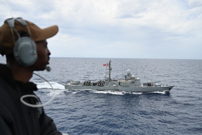 200613-N-NO901-0001 (MEDITERRANEAN SEA) A Sailor assigned to Arleigh Burke-class guided-missile destroyer USS Porter (DDG 78) watches Tunisian fast attack craft FPB Hamilcar 505 during a passing exercise between the U.S. Navy and Tunisian Navy in the Mediterranean Sea, June 13, 2020. Porter, forward-deployed to Rota, Spain, is conducting naval operations in the U.S. 6th Fleet area of operations in support of U.S. national security interests in Europe and Africa. (U.S. Navy photo by Ensign Andrew Walker/Released)