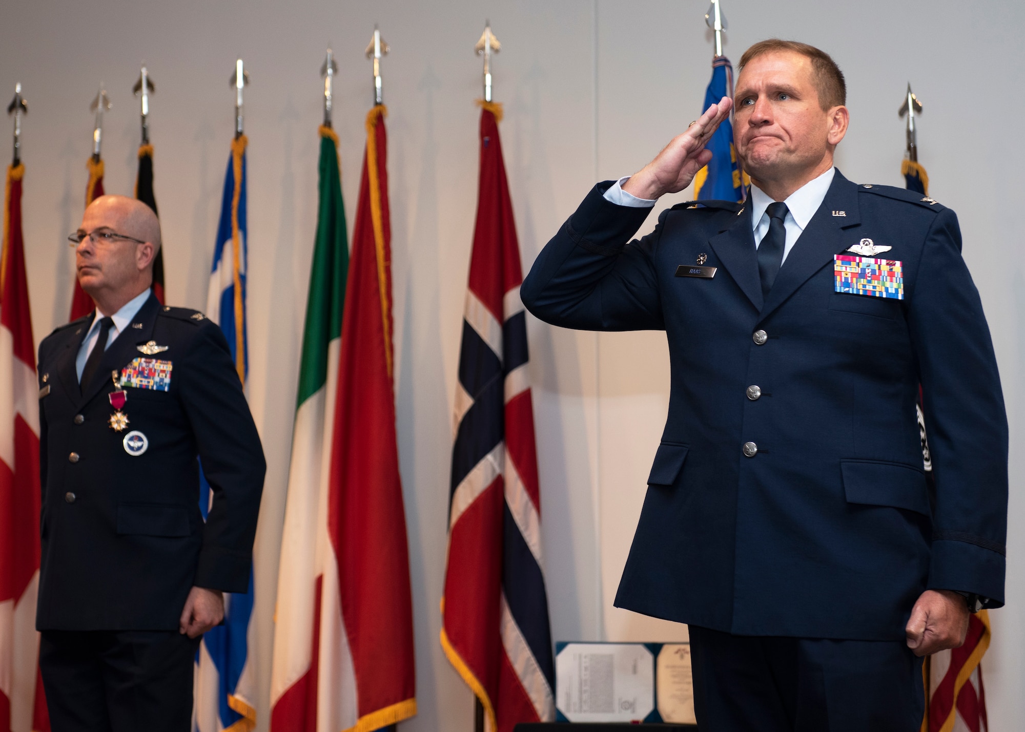 Haas renders a salute after accepting command of 80th FTW