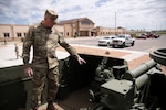 Staff Sgt. Brian Parrish talks about restoring the M-7 Howitzer in front of the Regional Training Institute at Camp Guernsey, Wyo., June 8, 2020. Members of the Wyoming National Guard used to M-7 during the Korean War.
