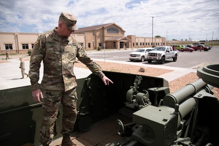 Staff Sgt. Brian Parrish talks about restoring the M-7 Howitzer in front of the Regional Training Institute at Camp Guernsey, Wyo., June 8, 2020. Members of the Wyoming National Guard used to M-7 during the Korean War.