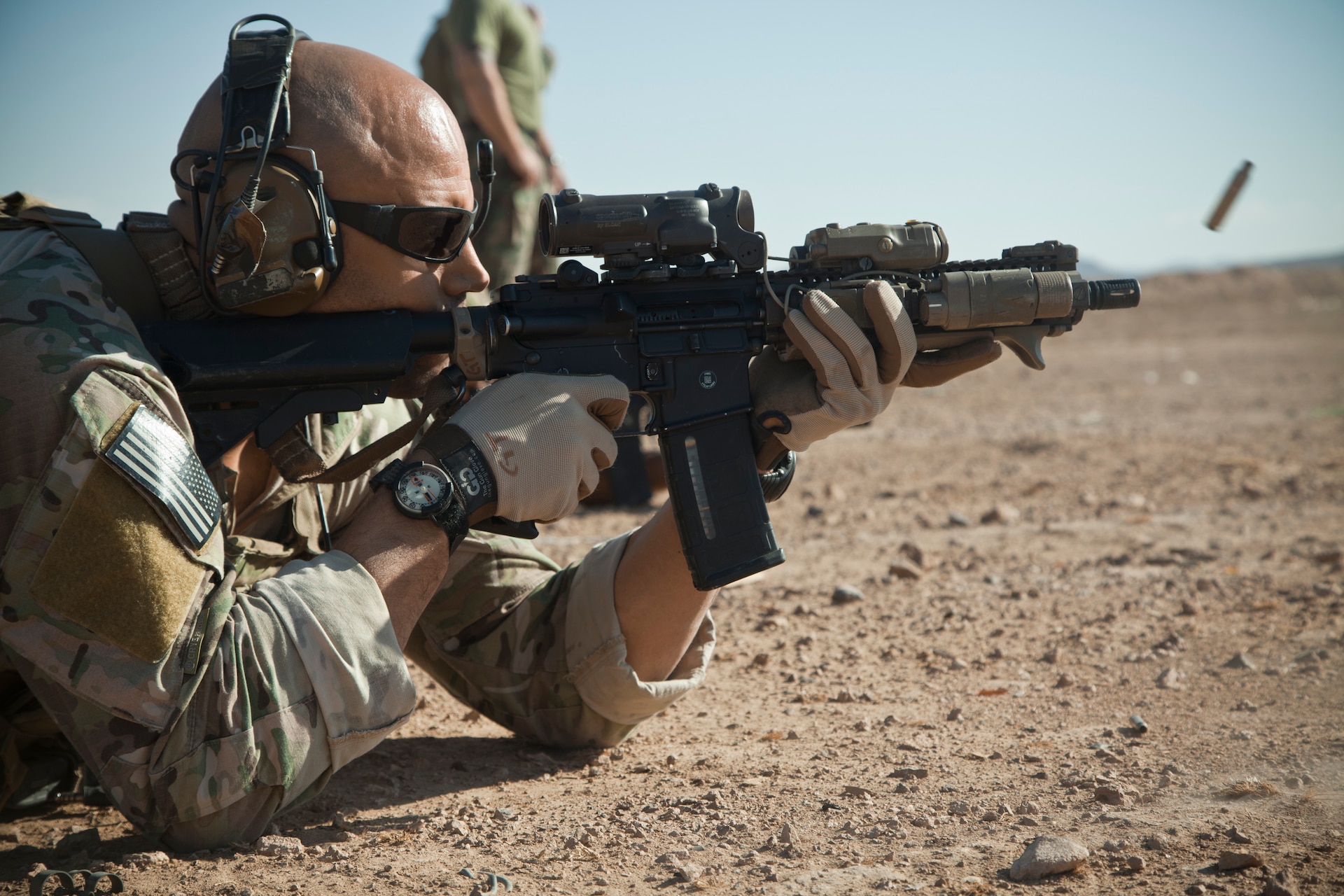 A coalition force member fires his M4 carbine during live fire training on a base in Herat province, Afghanistan, Nov. 9, 2012.