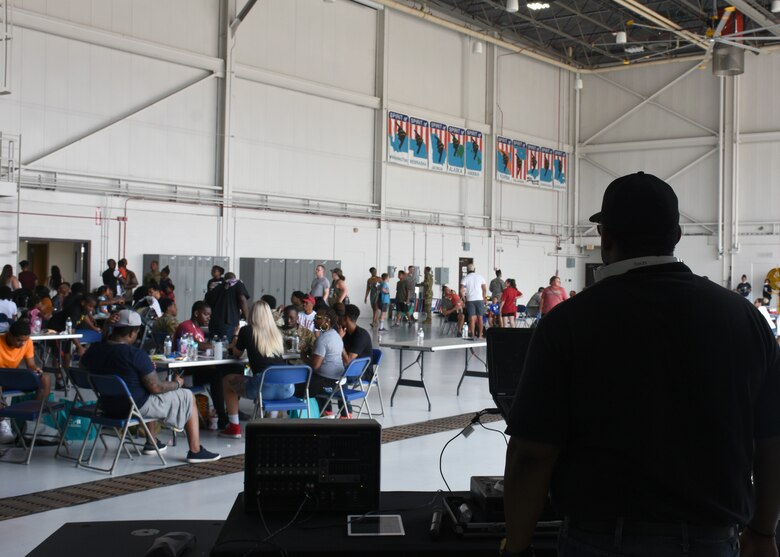 The DJ looks out over the crowd at the Juneteenth Festival on Whiteman Air Force Base, Mo.