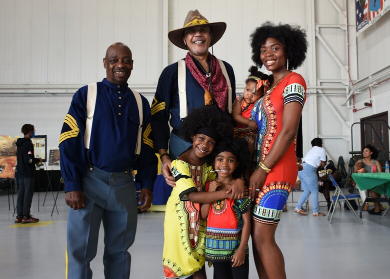 A family stands together at the Juneteenth festival on Whiteman Air Force Base, Mo.