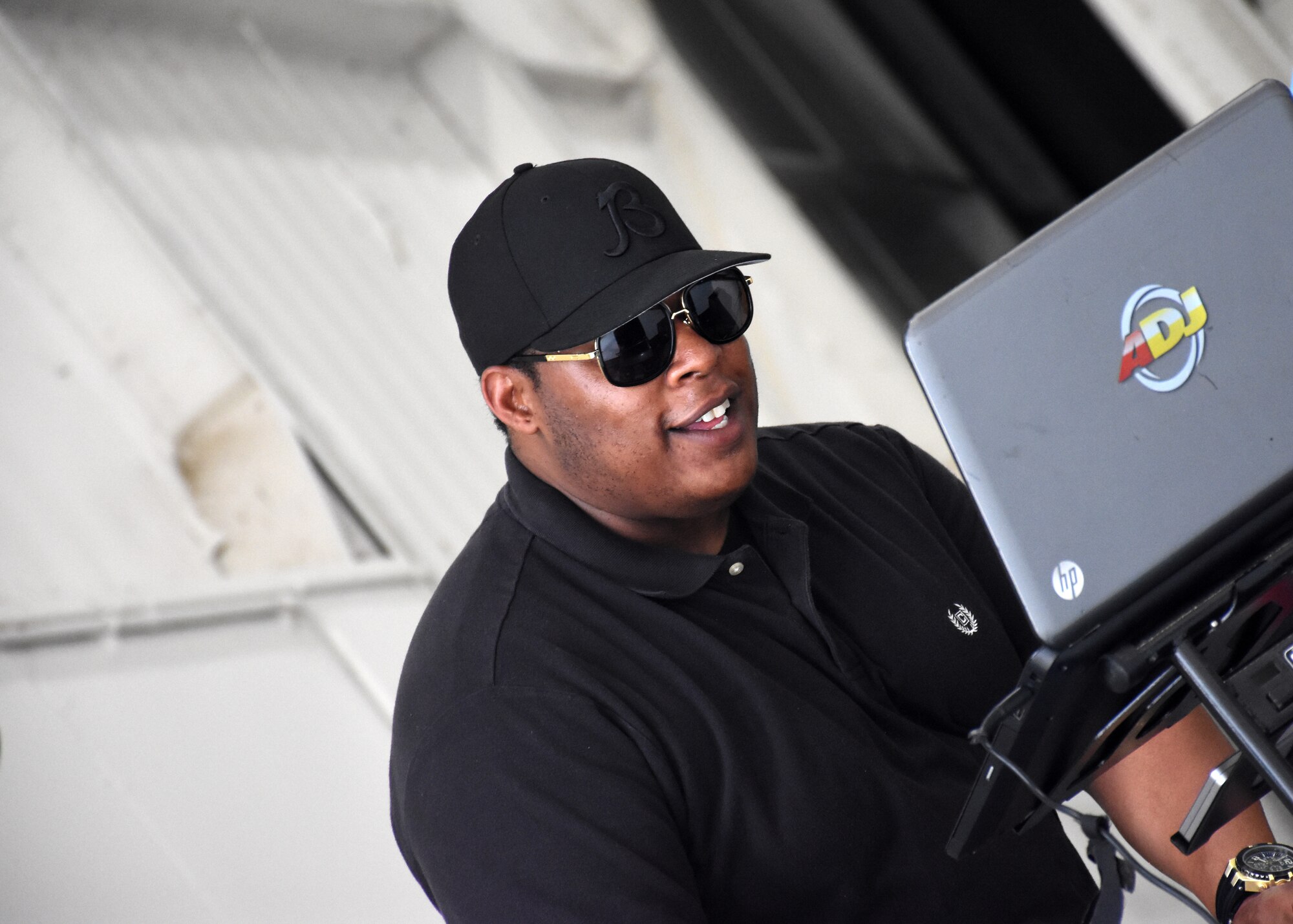 A DJ plays music at the Juneteenth festival on Whiteman Air Force Base, Mo.