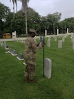 Spc. Jeremy McCrae, an Engineer Soldier, with the 512th Engineer Detachment checks coordinates of an American service member’s grave in Corozal American Cemetery in Panama City, Panama, June 28, 2018, as part of a certifying program to ensure precision and accuracy at the final resting places of American service members. The pilot program is supported through a cooperative effort between the American Battle Monuments Commission, Arlington National Cemetery, the United States Army Corps of Engineers, the Army GeoSpatial Center and Product Director Combat Terrain Information Systems. (U.S. Army Photo/Courtesy USACE)