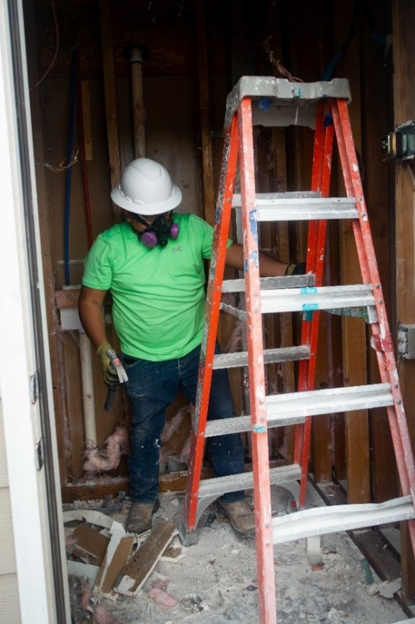 Joel Cisneros, a contractor hired by Balfour Beatty Communities, performs construction work on a utility closet inside a base housing unit on Tinker AFB, Okla., May 22, 2020.  Base officials have pushed Balfour Beatty to commit to a long-term plan of action to improve base housing and address serious health hazards inside homes. (U.S. Air Force photo by 2Lt. Danny Rangel)