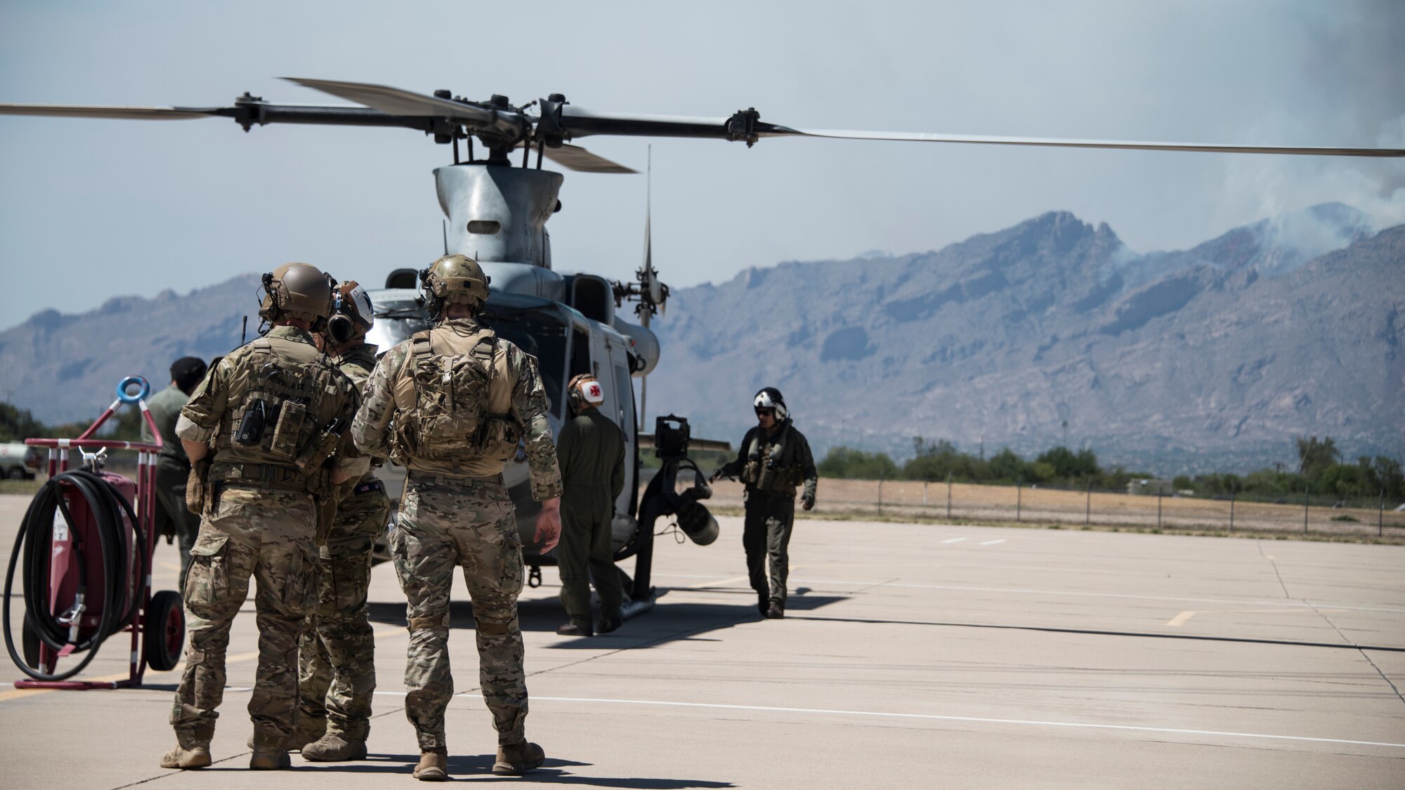 A photo of Airmen preparing to board a helicopter