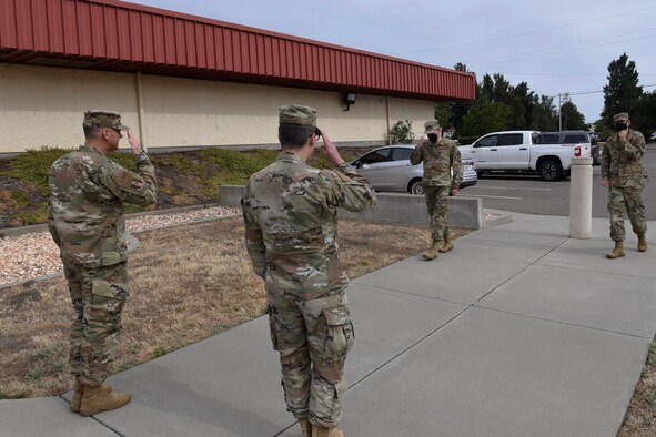 U.S. Air Force Senior Master Sgt. Michael Leard, left, 60th Maintenance Group maintenance operations superintendent, and Capt. Brennan Sumpter, middle left, 60th MXG maintenance operations officer in charge, greet Col. Jeffrey Nelson, middle right, 60th Air Mobility Wing commander, and Chief Master Sgt. Derek Crowder, 60th AMW command chief, June 12, 2020, at Travis Air Force Base, California. The Leadership Rounds program provides 60th AMW leadership an opportunity to interact with Airmen to get a detailed view of each mission performed at Travis AFB. (U.S. Air Force photo by Airman 1st Class Cameron Otte)