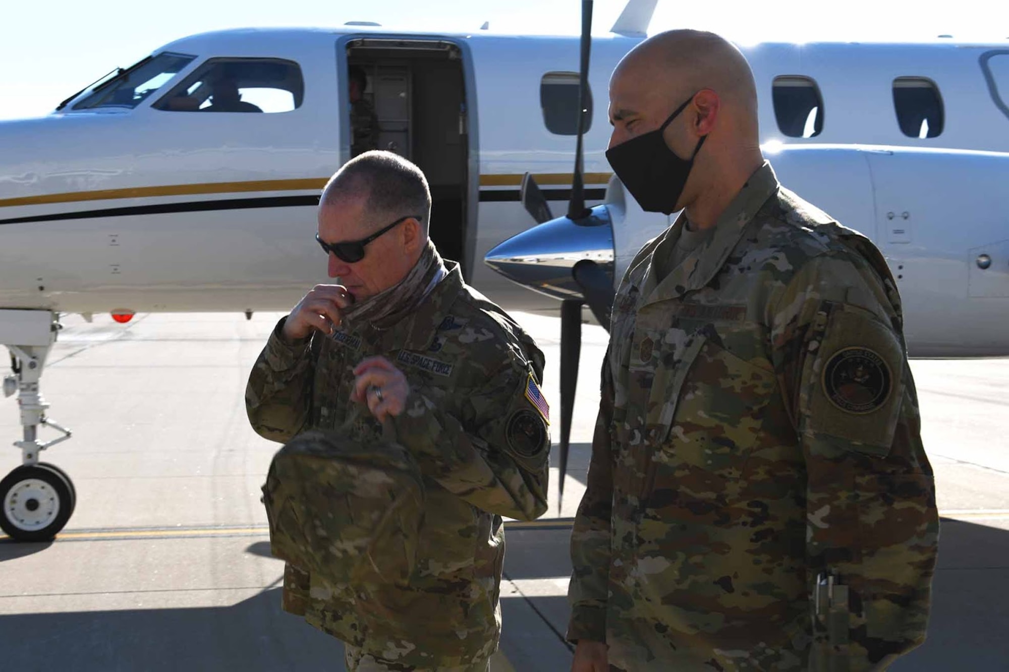 Chief Master Sgt. Roger A. Towberman, U.S. Space Force senior enlisted advisor and the U.S. Space Command senior enlisted leader (left), speaks to Chief Master Sgt. Robert Devall, 460th Space Wing Command Chief, at Buckley Air Force Base, Colo., June 17, 2020. Towberman visited Buckley to recognize members for outstanding performances during the COVID-19 pandemic. (U.S. Air Force photo by Airman 1st Class Andrew I. Garavito)