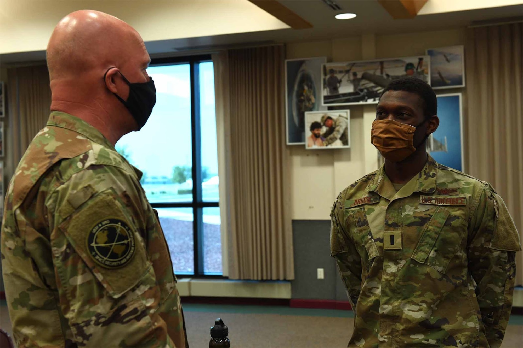 Gen. Jay Raymond, U.S. Space Force Chief of Space Operations and U.S. Space Command commander, greets 1st Lt Charles Bruce, 2nd Warning Squadron before a luncheon discussing modern day issues. Raymond visited Buckley Air Force Base, Colo., June 17, 2020 to recognize Team Buckley’s outstanding performers.  (U.S. Air Force photo by Airman 1st Class Andrew I. Garavito)