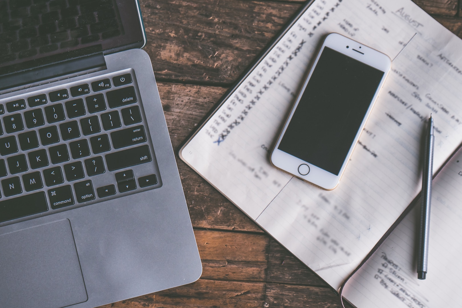 Stock photo of a desk with laptop and mobile phone